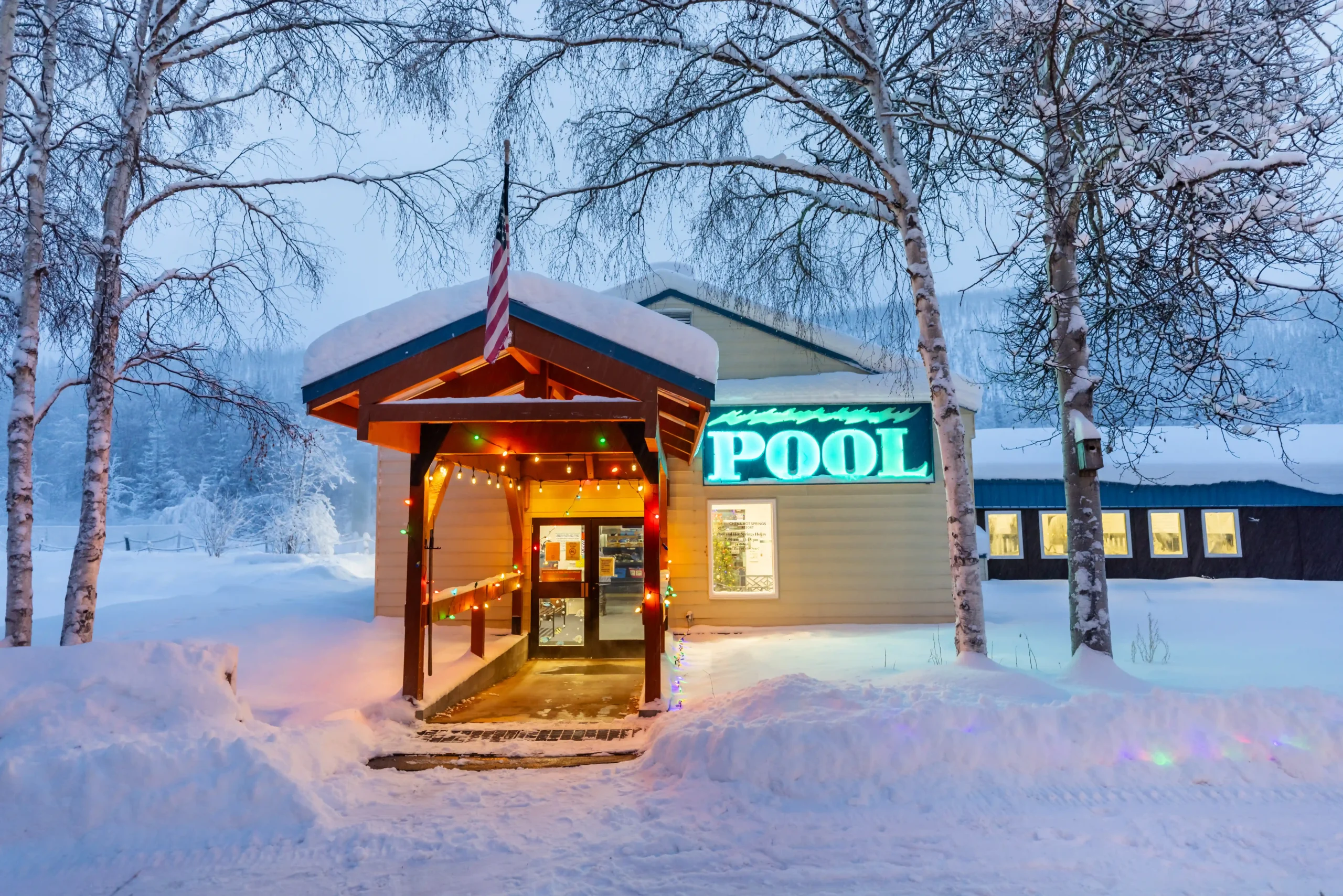 the pool house covered in snow at chena hot springs resort