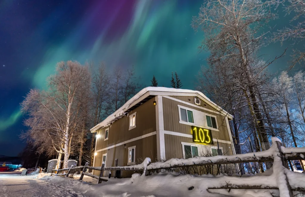 lodging under northern lights at night at chena hot springs in Alaska