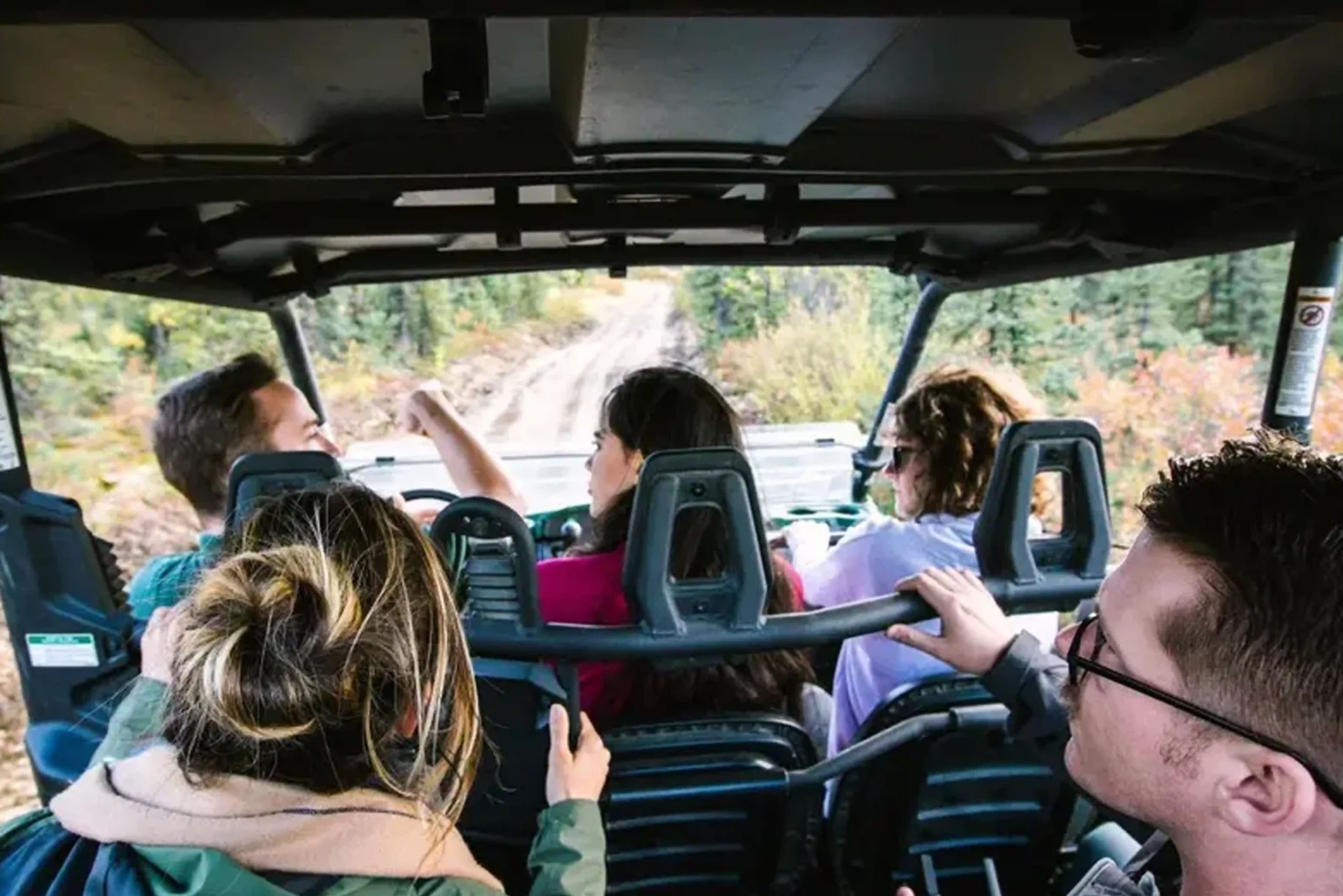 side by sdide atv tour guide and guests at chena